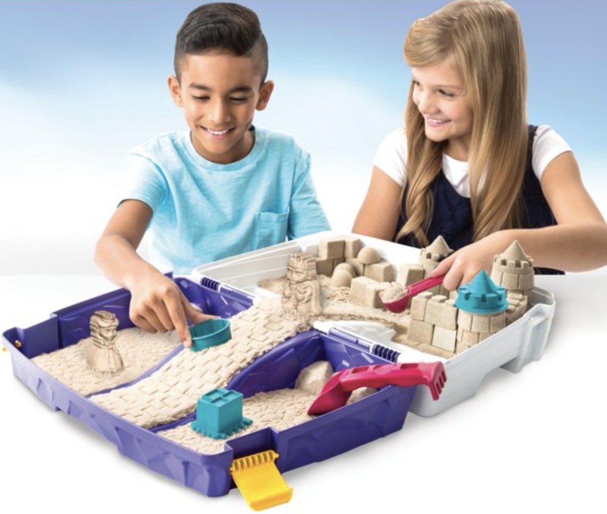 Kids playing with kinetic sand kit