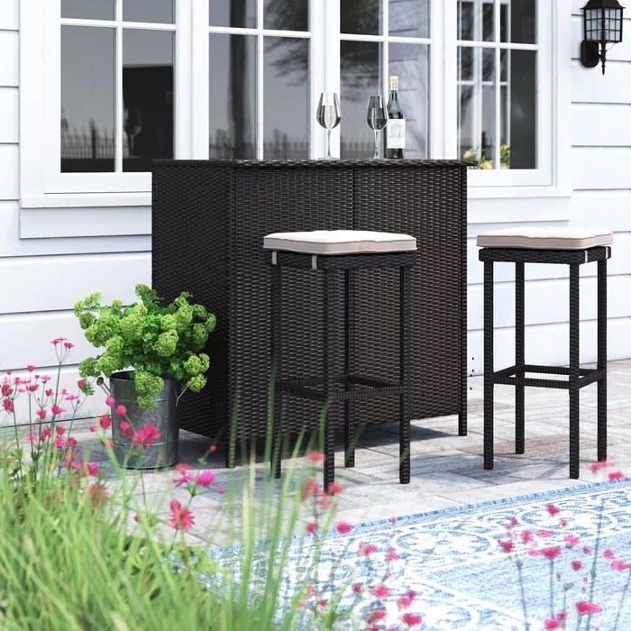 outdoor bar and two bar stools on patio