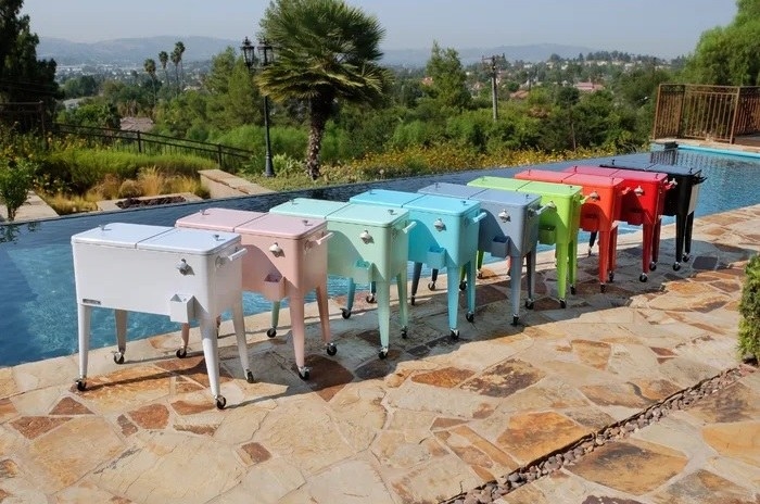 the colorful coolers lined up beside a pool