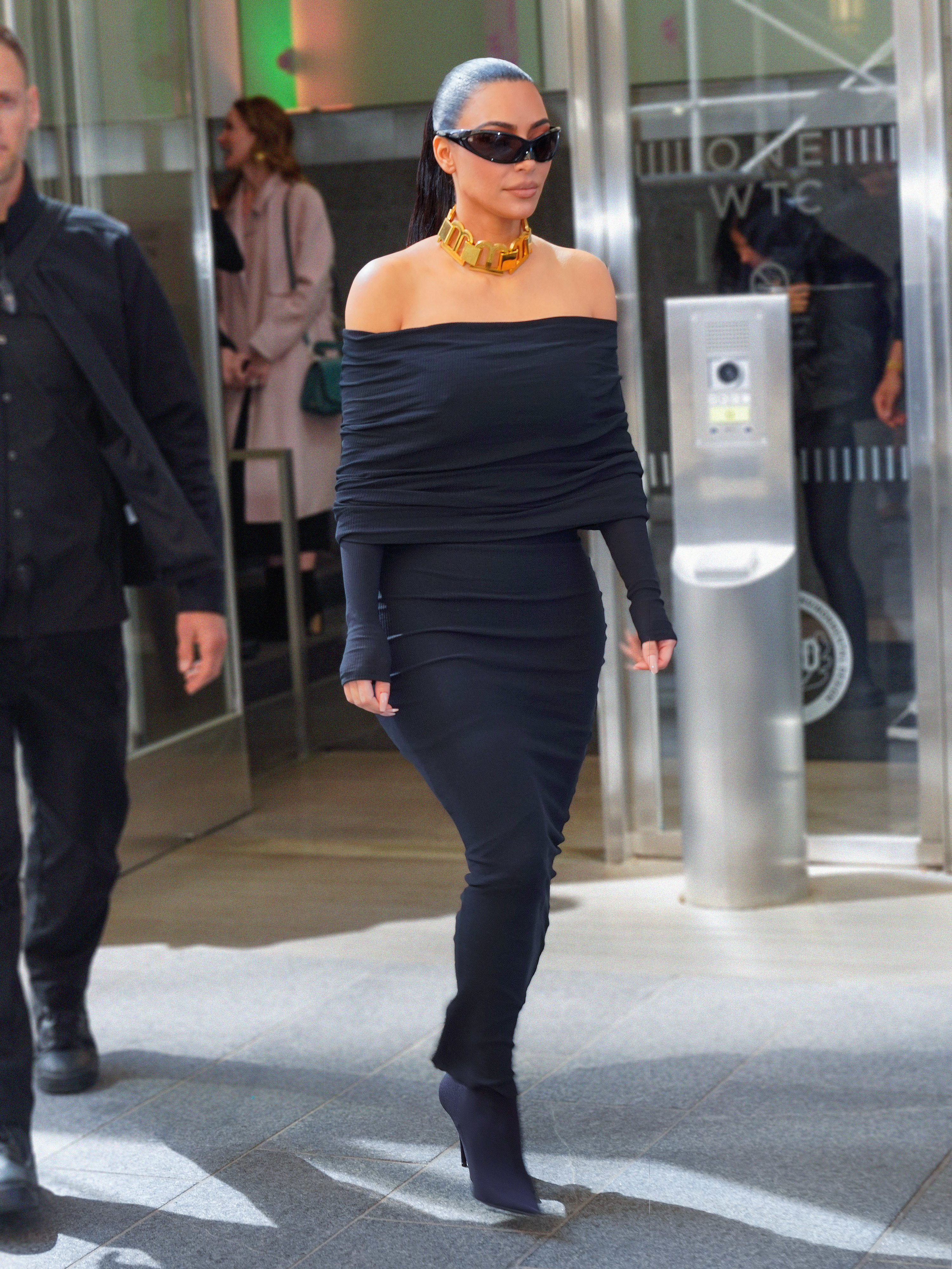Kim walks outside