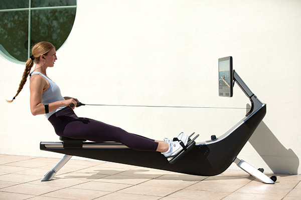 Woman working out on a Hydrow Rowing Machine