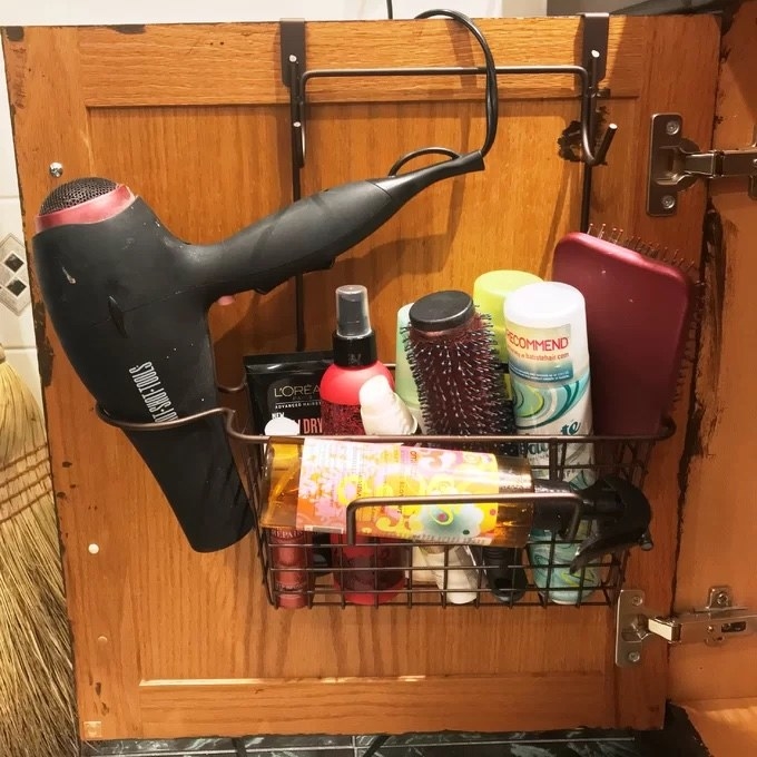 The holder with bathroom tools in it