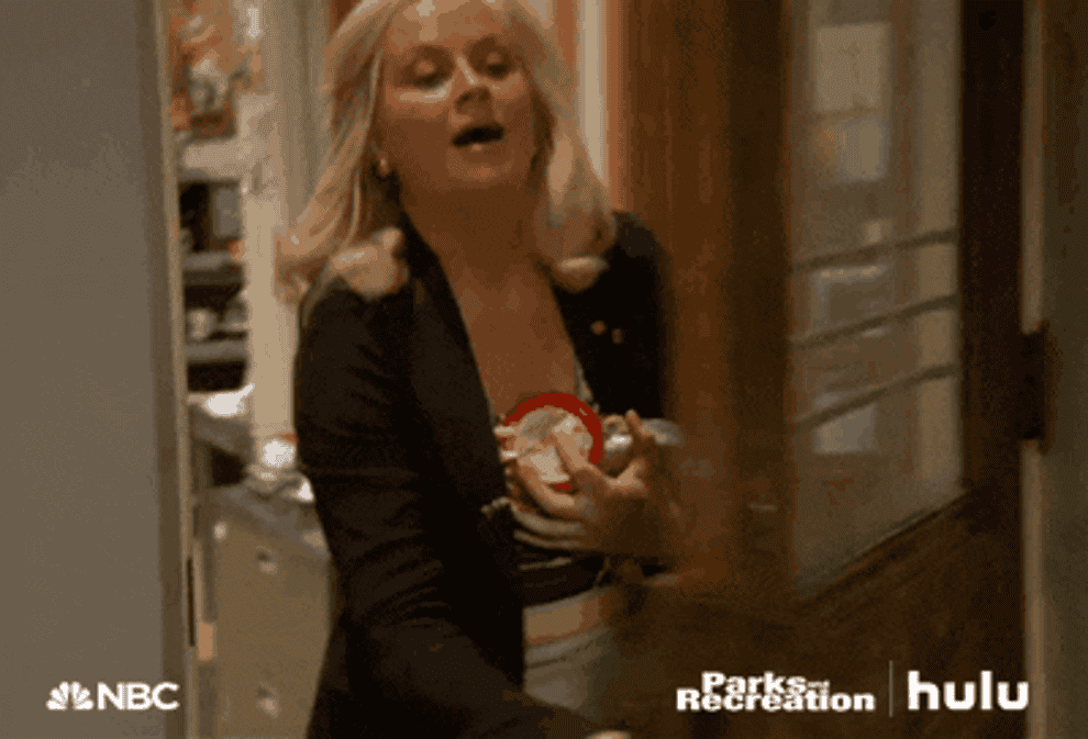 GIF of Leslie Knope with a bottle of wine on &quot;Parks and Recreation&quot;