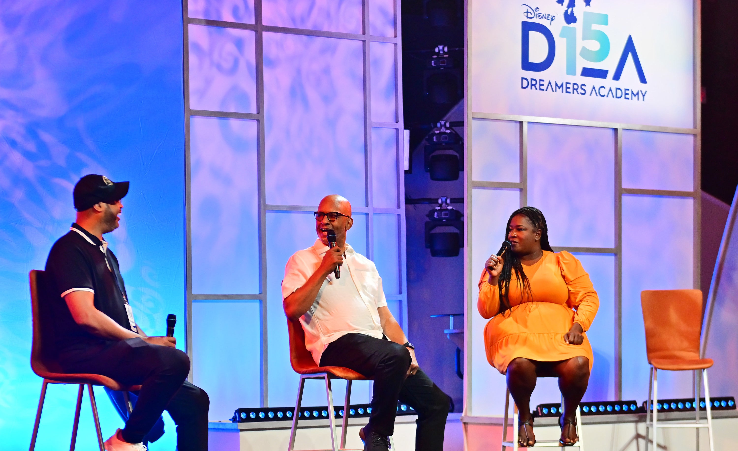 Bruce Smith and Ralph Farquhar speak on stage at the Disney Dreamers Academy.