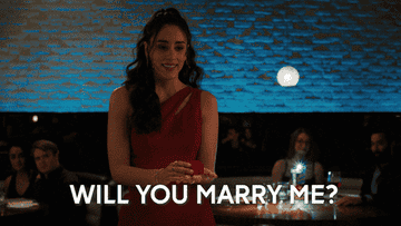 Woman asking with a ring, &quot;Will you marry me?&quot;