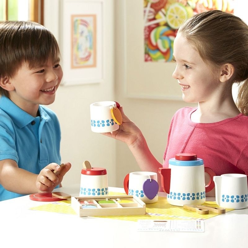 Kids playing with tea set