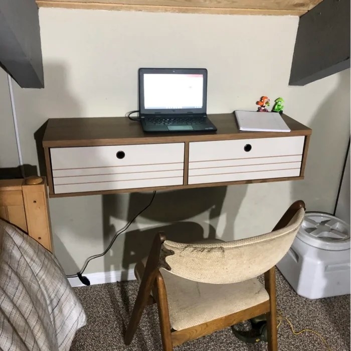 A cinnamon colored floating wall desk