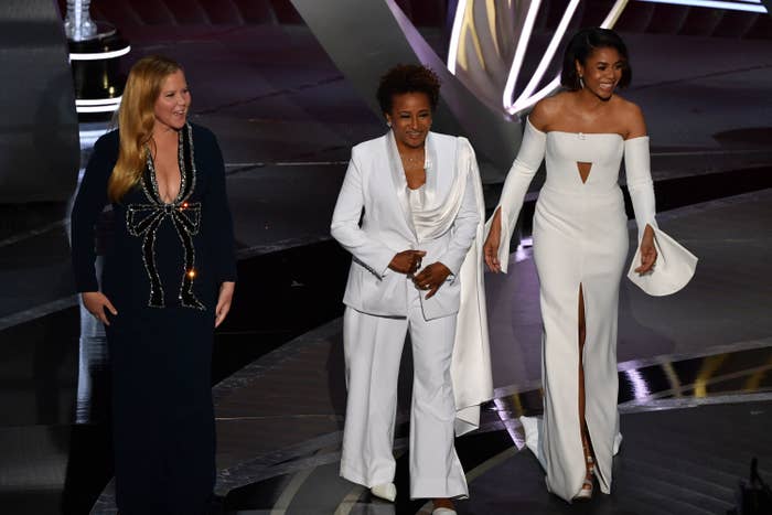 Amy Schumer, Wanda Sykes and Regina Hall on stage hosting the Oscars