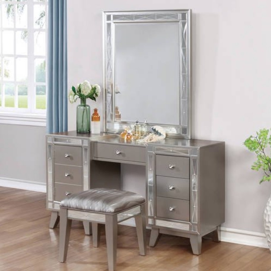 A metallic vanity with a matching stool