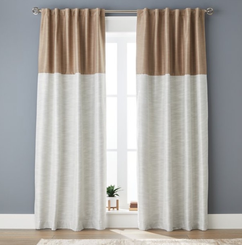 A set of brown/white color-block blackout curtains