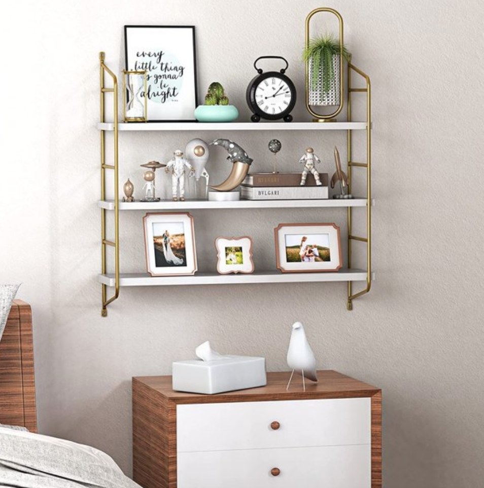 A gold/white wall mounted 3 tier shelves