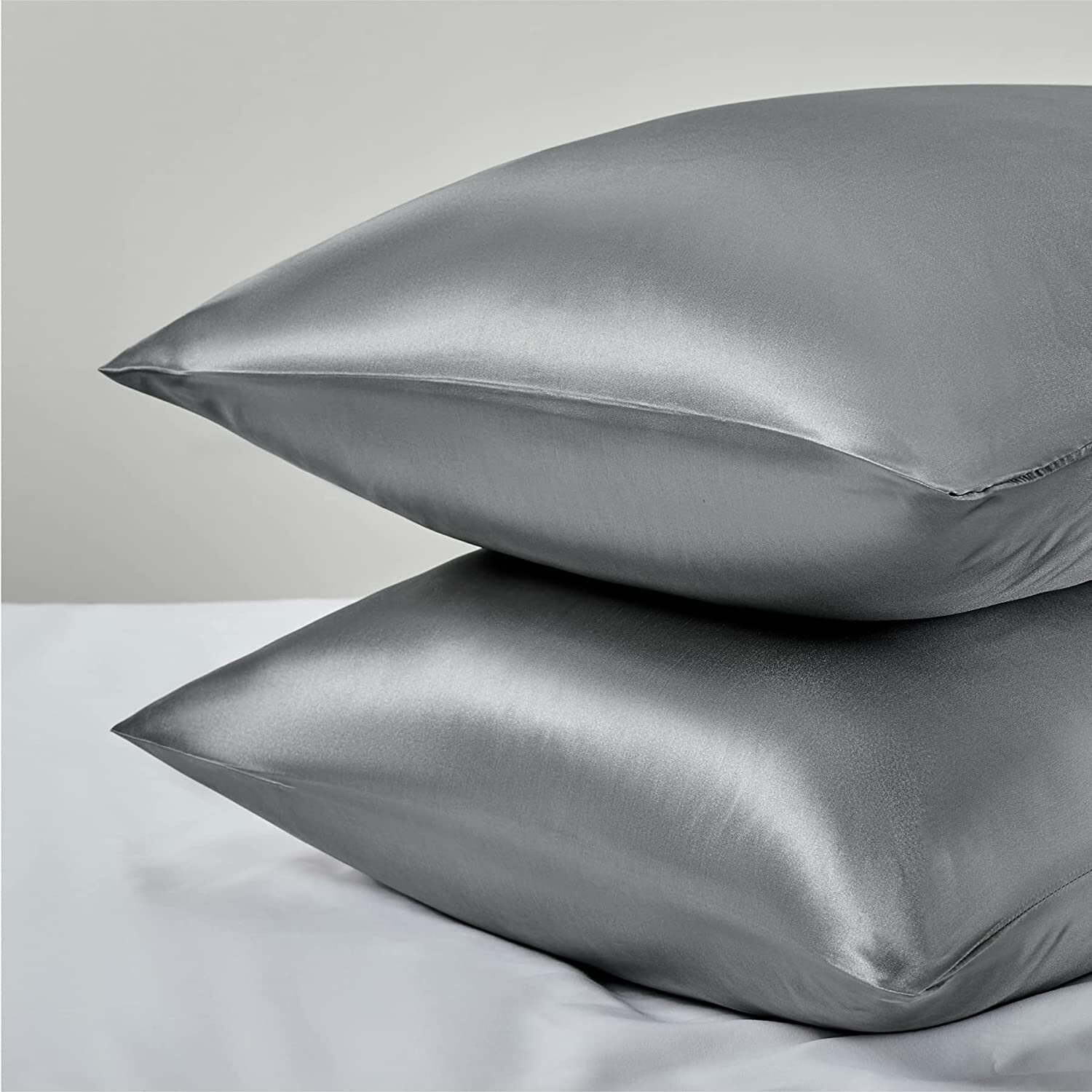 The satin pillows stacked on top of each other