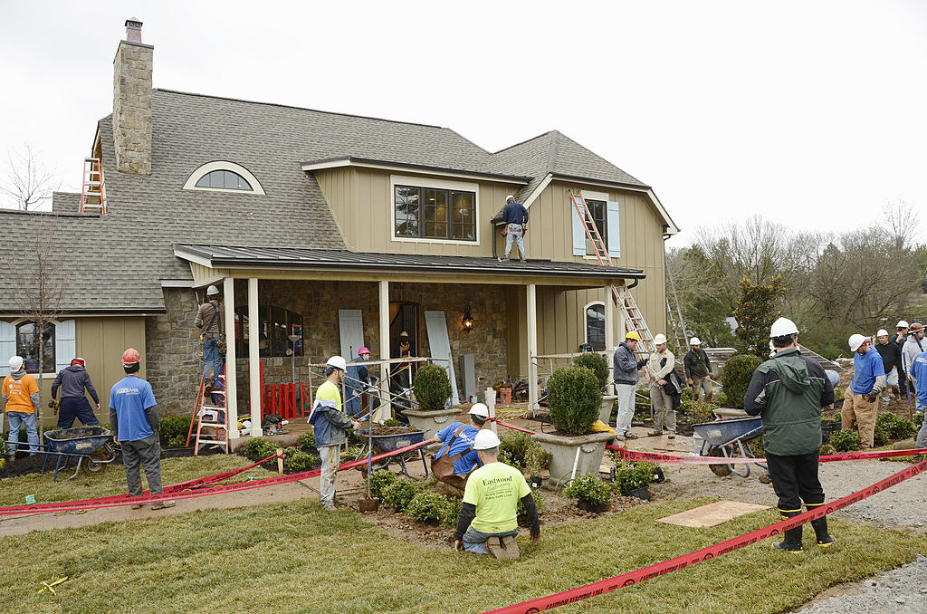 volunteers working on a new house