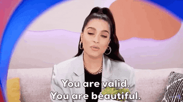 Woman saying &quot;You are valid. You are beautiful&quot;