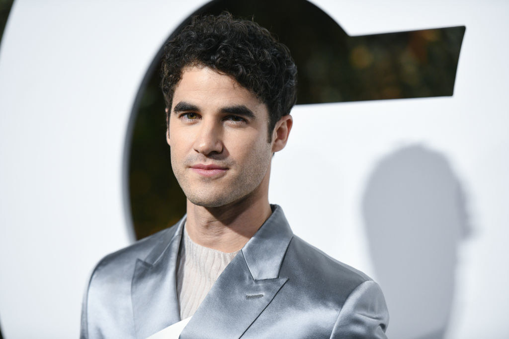 Headshot of Darren wearing a shiny jacket