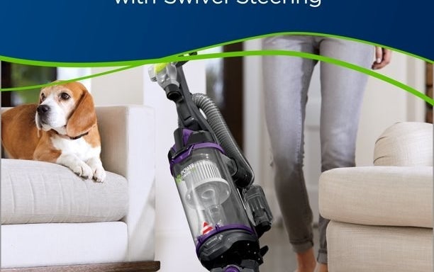 model cleaning white carpet with purple and black Bissell pet vacuum