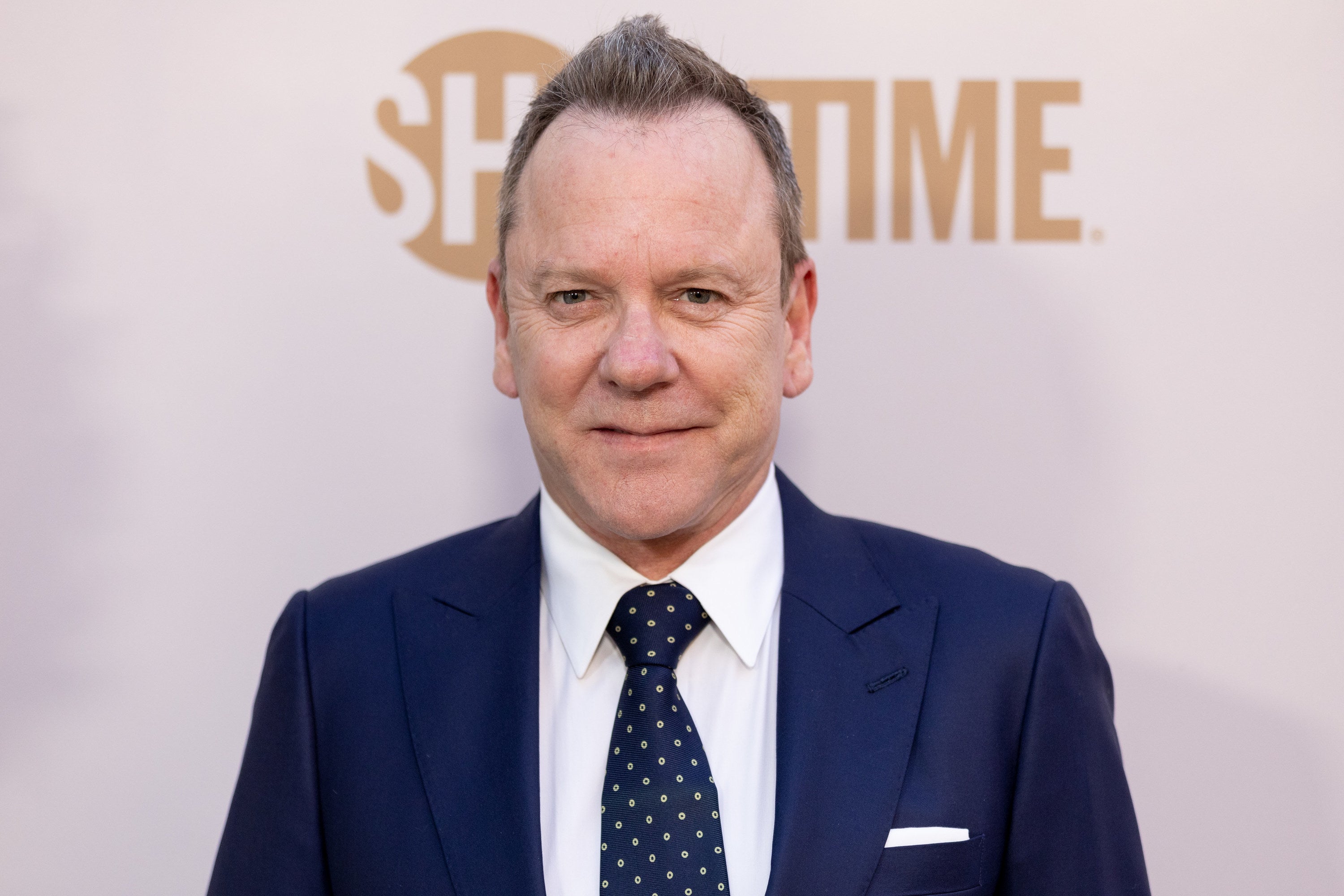 Kiefer Sutherland smiles