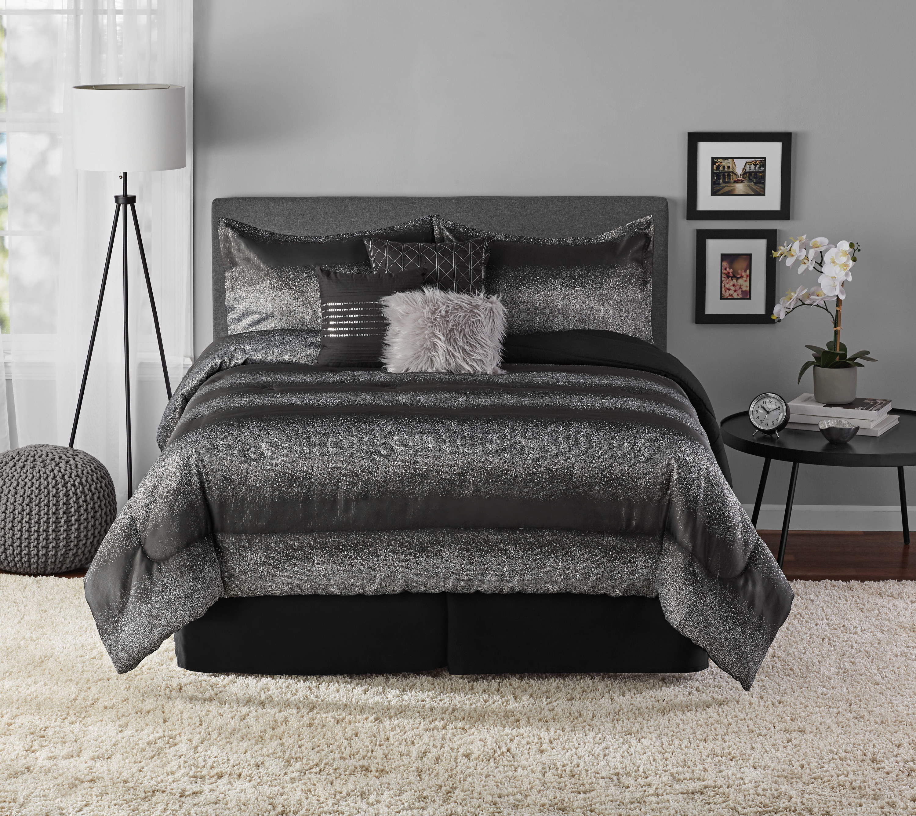 An image of a seven-piece comforter set that includes a comforter, two shams, one bed skirt, and three decorative pillows