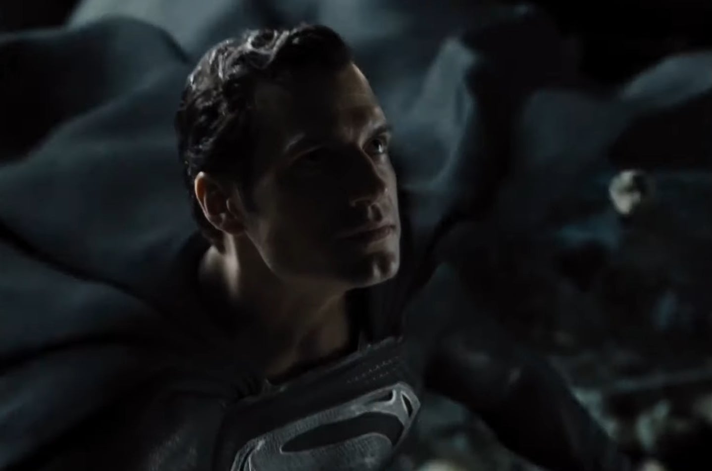 Superman in his black suit preparing to take flight in &quot;Zack Snyder&#x27;s Justice League&quot;