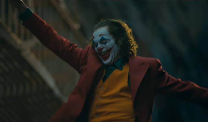 Arthur as the Joker dancing down a flight of stairs in &quot;Joker&quot;