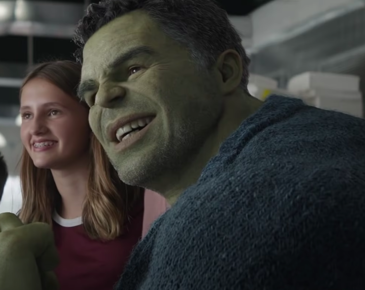 Lia smiling next to the Hulk