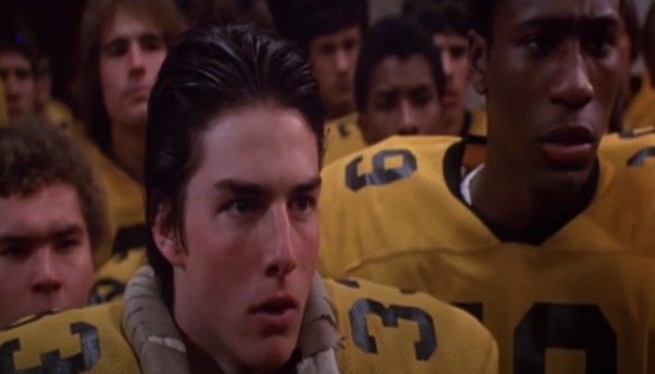 Stef (Tom Cruise) in a yellow football jersey