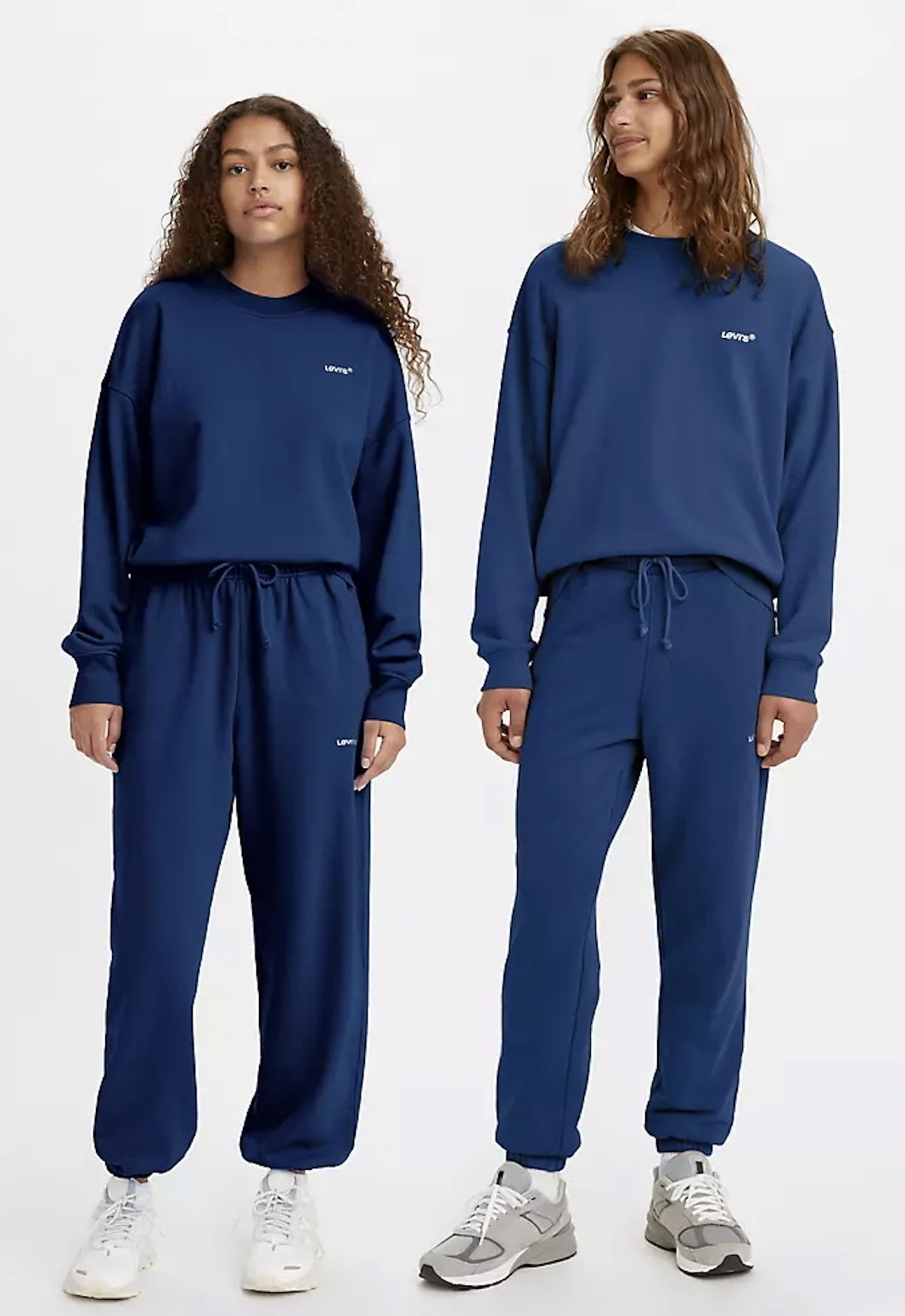 male and female model wearing the blue sweatsuits