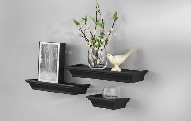 An image of a three-piece floating shelf set mounted onto a wall
