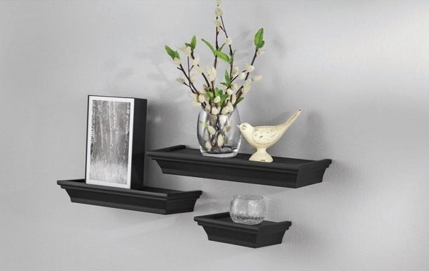 An image of a three-piece floating shelf set mounted onto a wall
