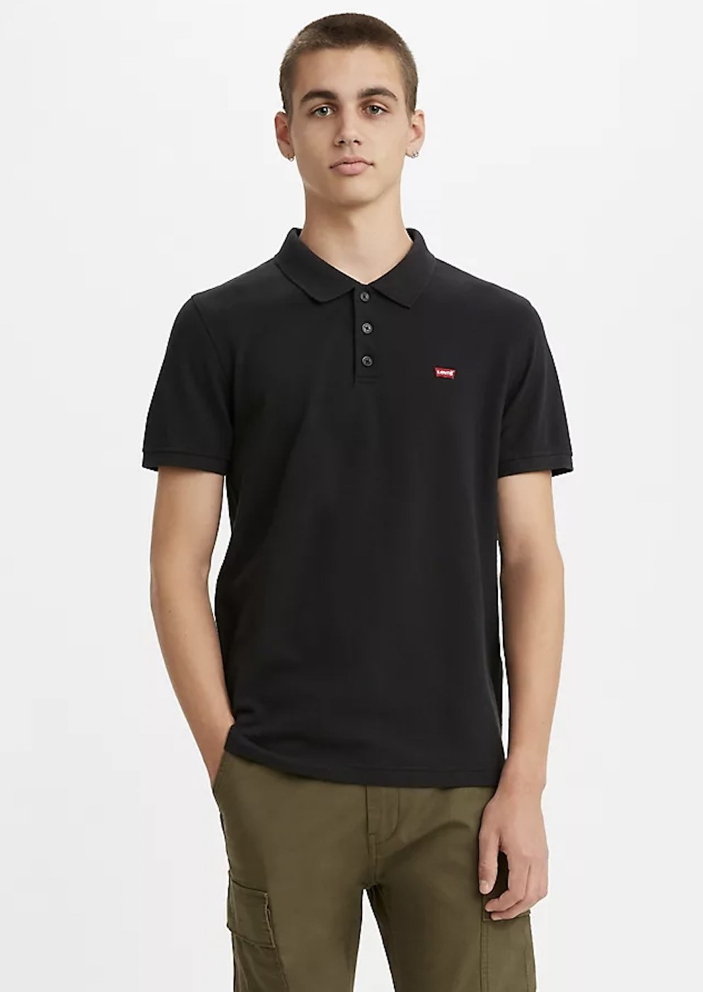 a model wearing the polo top in black