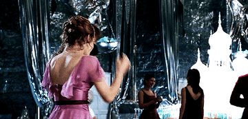 Hermione twirls in a pink dress