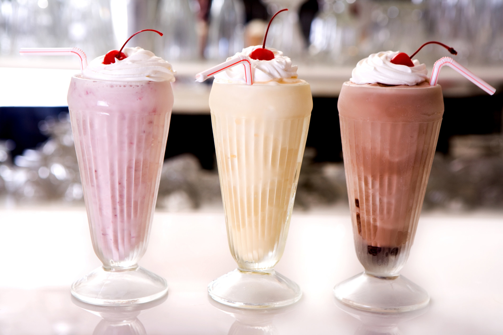 Cups of different flavored milkshakes.