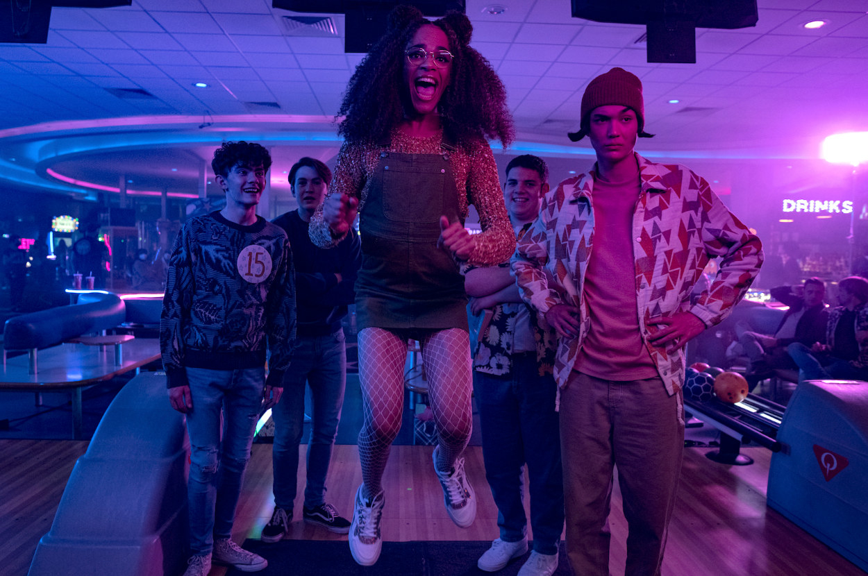 The young cast of Heartstopper are bowling together at Charlie&#x27;s party Elle jumps in excitement and they all watch a bowl roll down an alley off camera