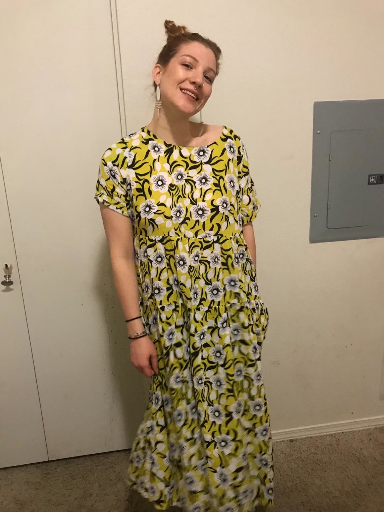 Reviewer wearing the yellow and white Bohemian floral dress