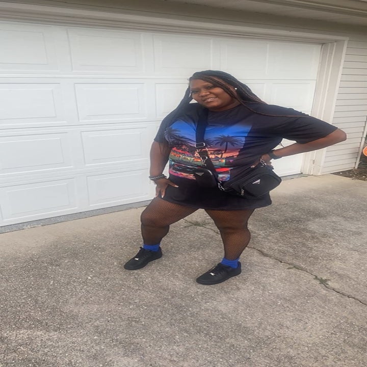 Reviewer wearing the black graphic t-shirt dress