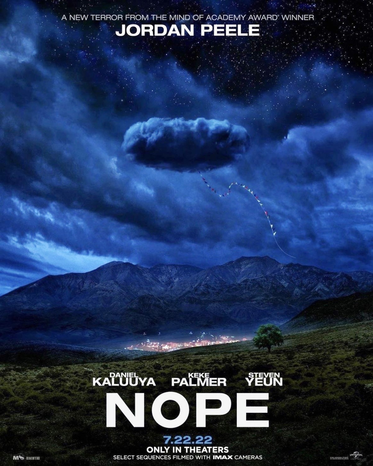 A string of flags hangs out of a cloud in the poster for Nope