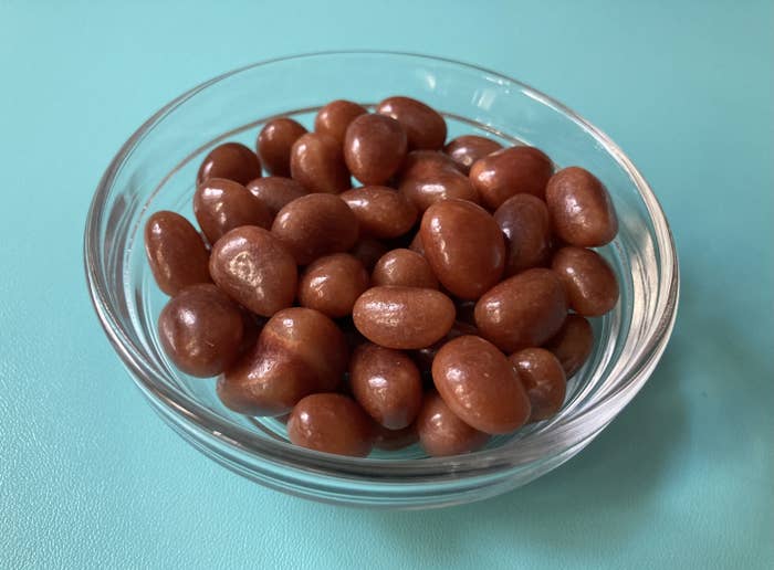a bowl of brown toasted coconut jelly beans