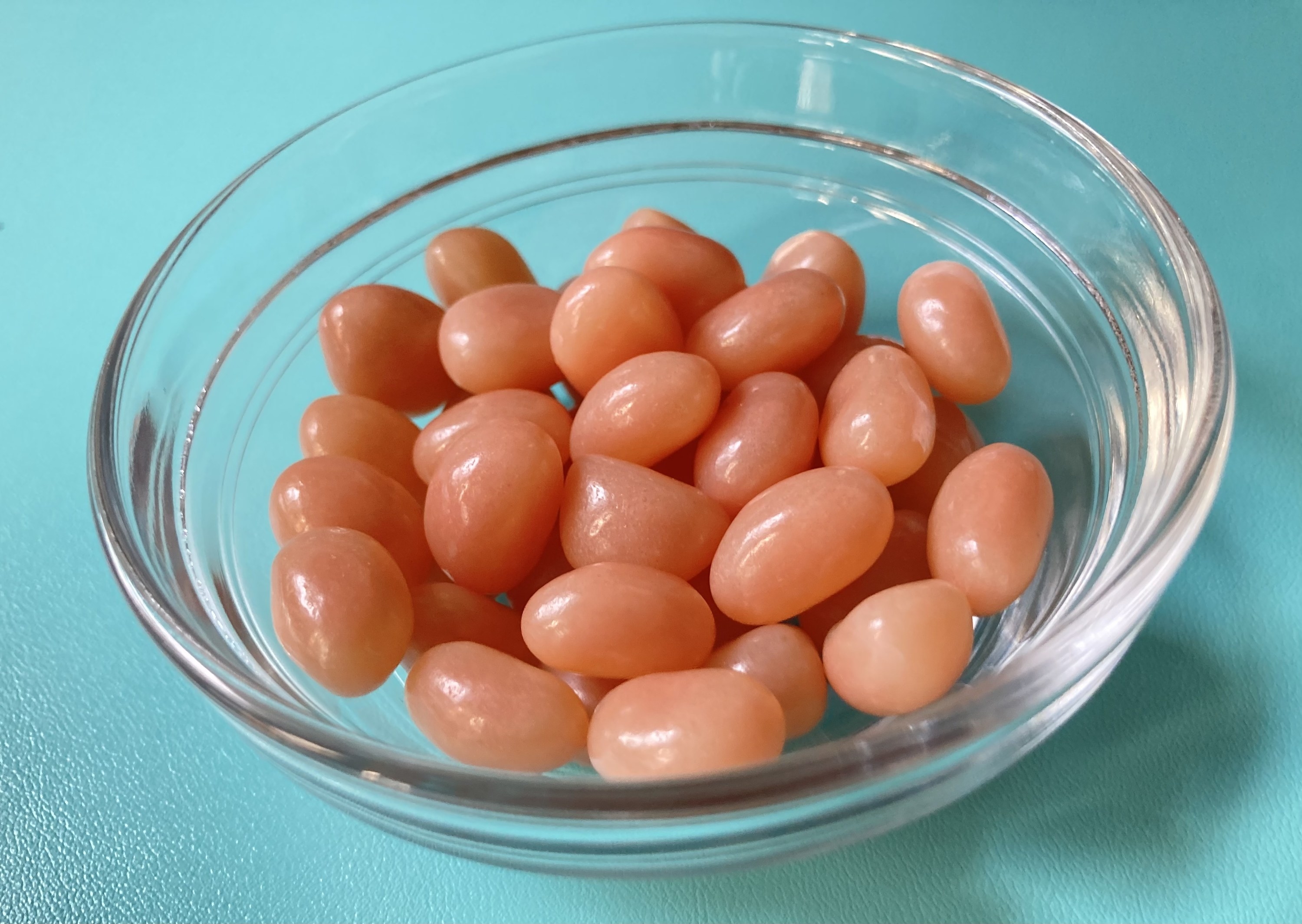a bowl of pink hazelnut jelly beans
