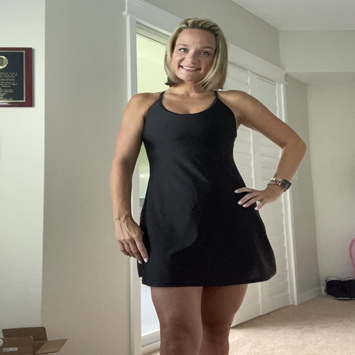 Reviewer wearing the black workout dress with built-in shorts