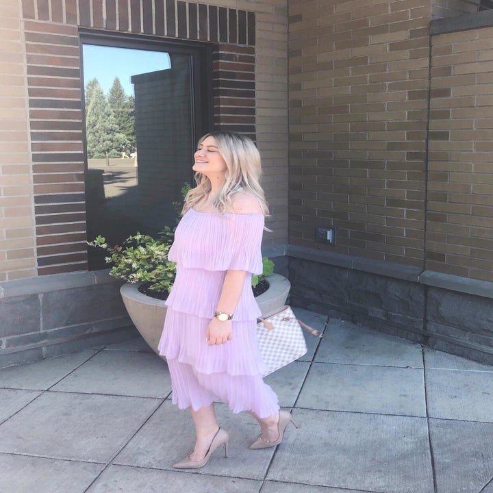 Reviewer wearing the purple chiffon off-the-shoulder party dress