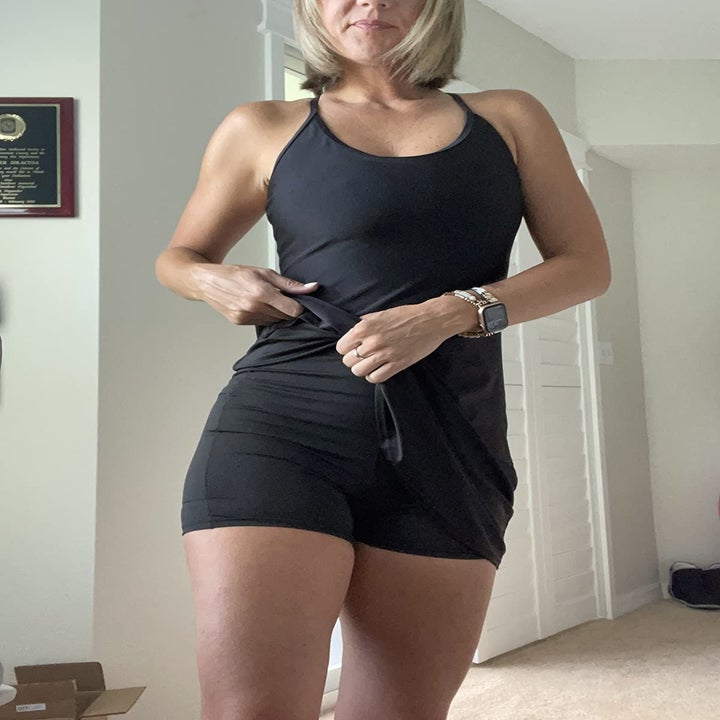 Reviewer wearing the black workout dress with built-in shorts
