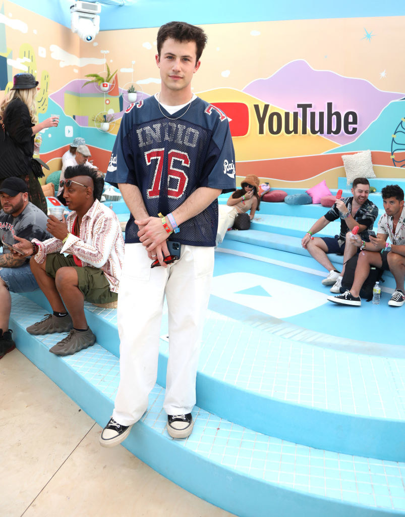 Dylan Minnette at Coachella in a football jeersey and pants