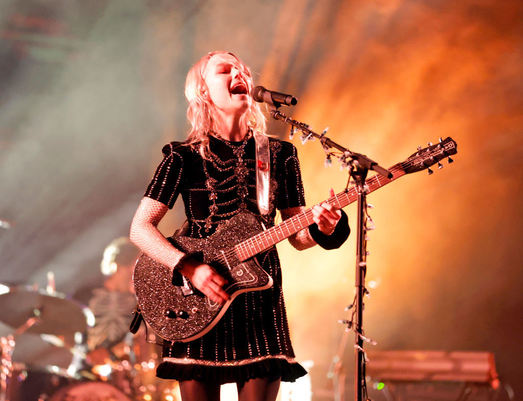 Phoebe Bridgers performs onstage at Coachella in a short sparkly dress