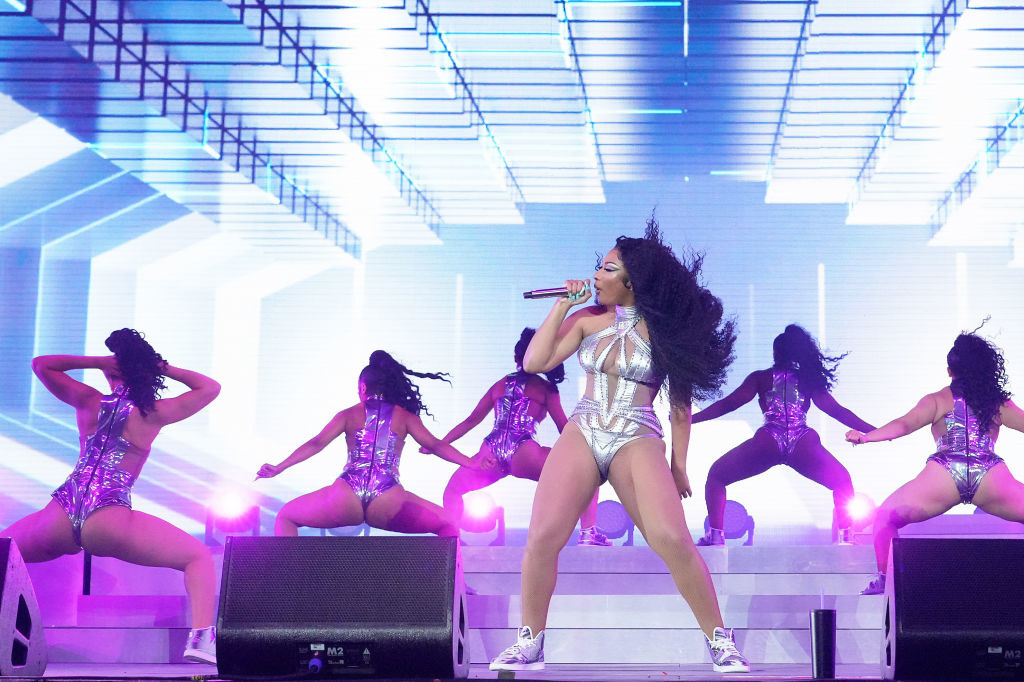 Megan Thee Stallion performing onstage at Coachella in a bodysuit