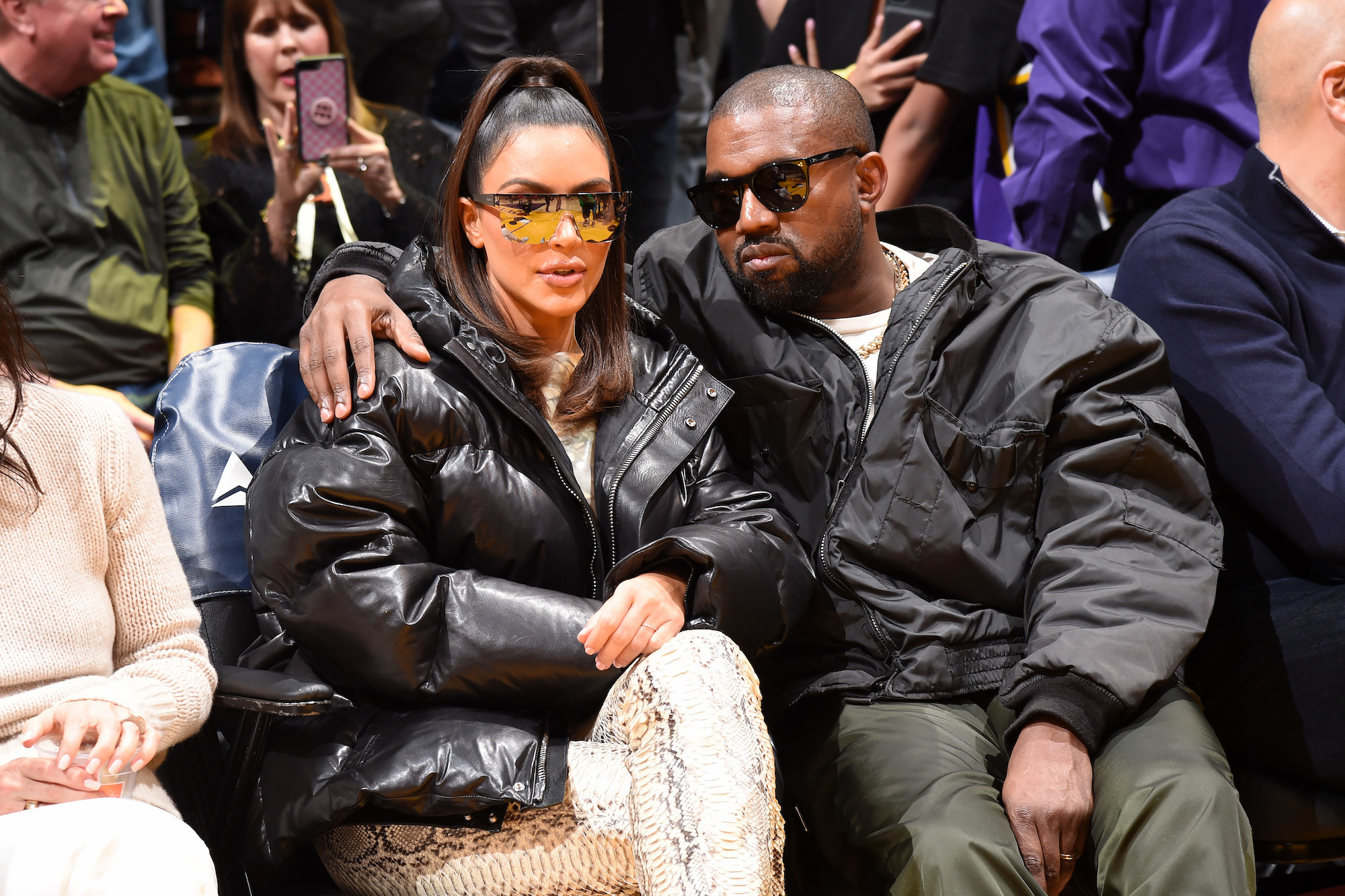 Kim and Kanye sit next to each other
