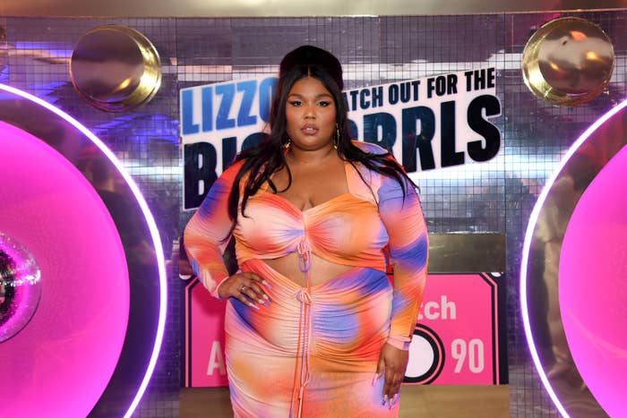 Lizzo poses at an event