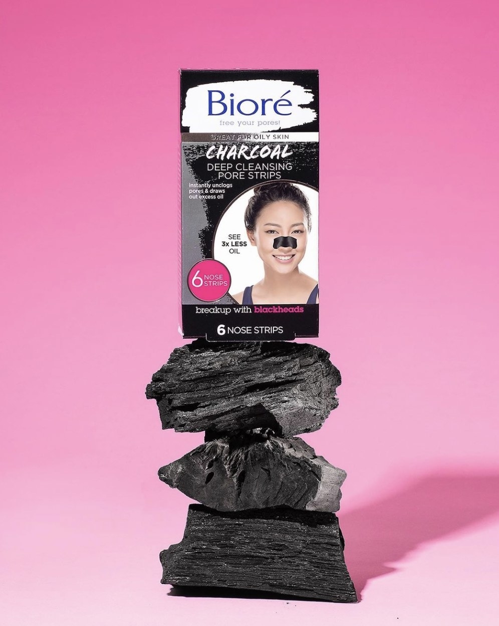 A package of pore strips on top of a stack of charcoal srips
