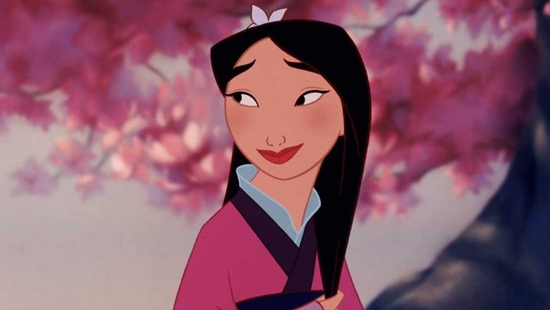 Mulan sitting under a cherry blossom team with a flower in her hair