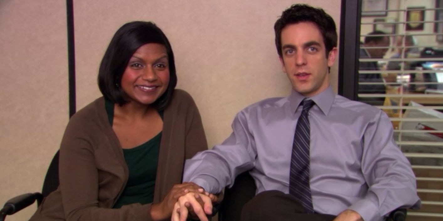 Kelly smiles brightly while holding Ryan&#x27;s hand who looks terrified