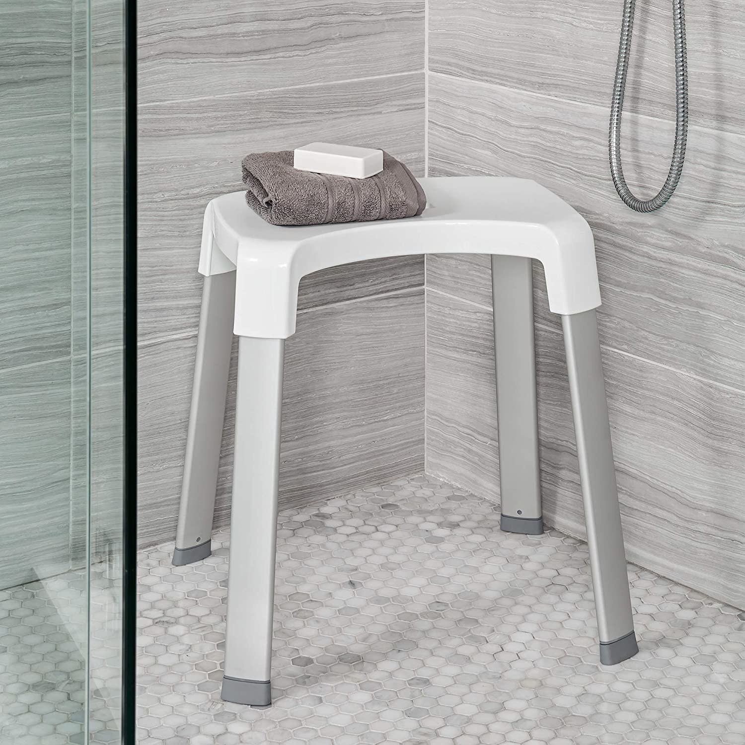 a shower stool inside a shower stall